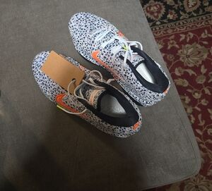 Nike Athletic Shoes with Orange and Black Accents